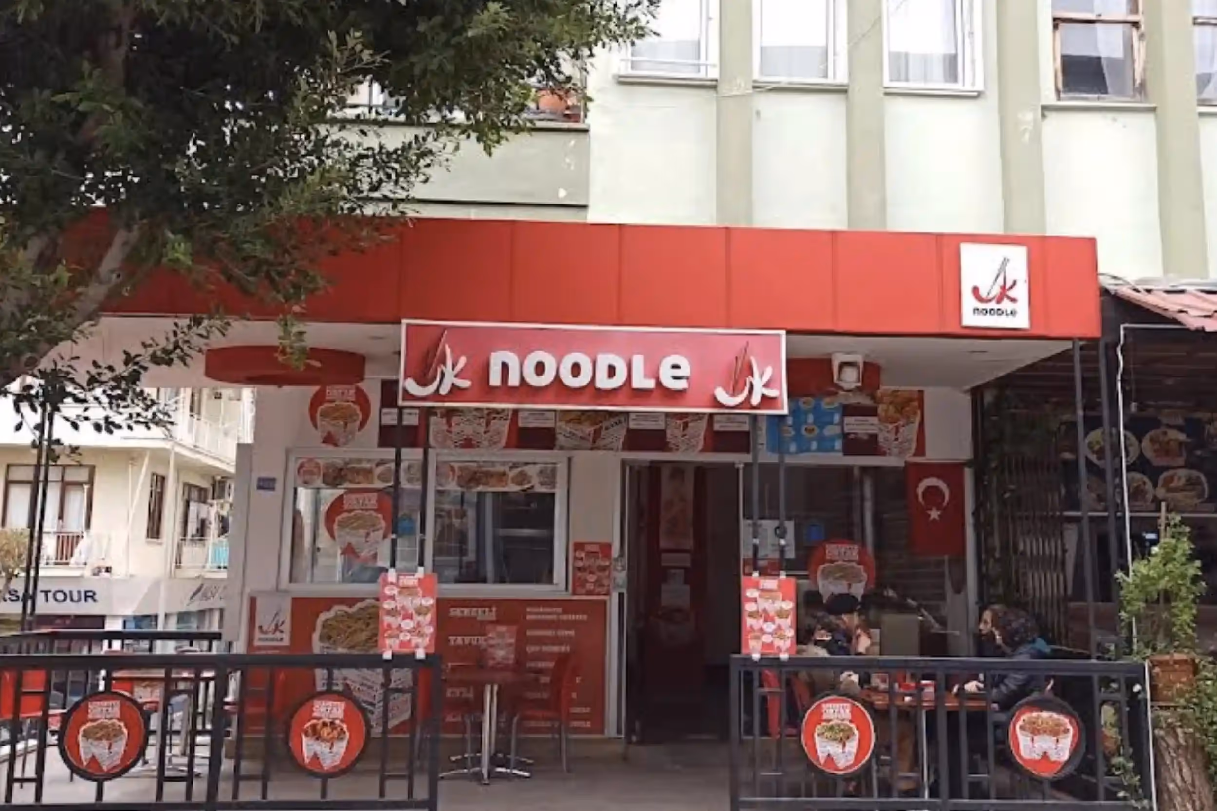 A small restaurant specializing in Asian-style noodles. The menu includes only a few dishes: